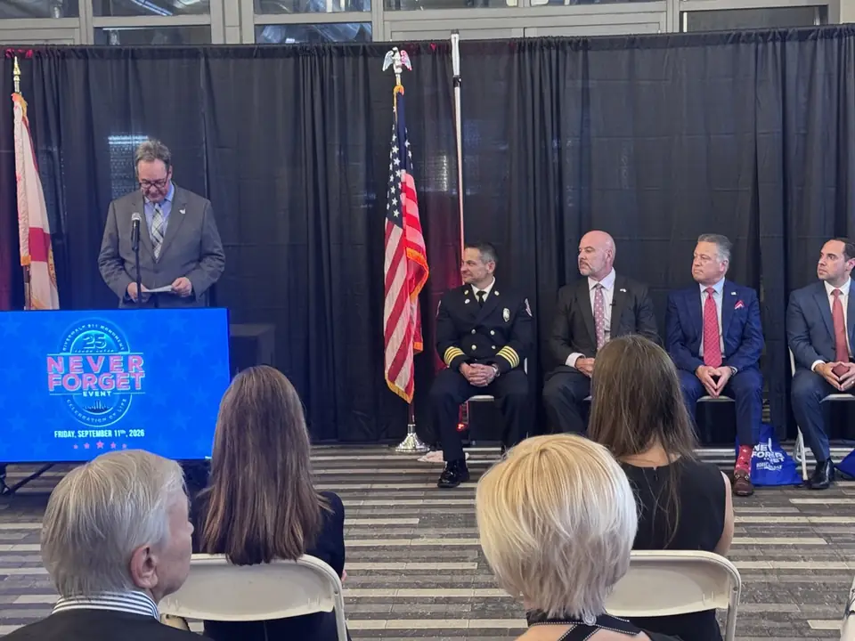 The stage, panel and audience at the Never Forget event.