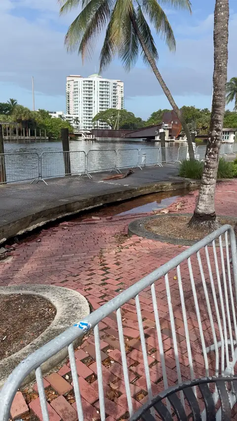 Barricades along the damaged walkway.