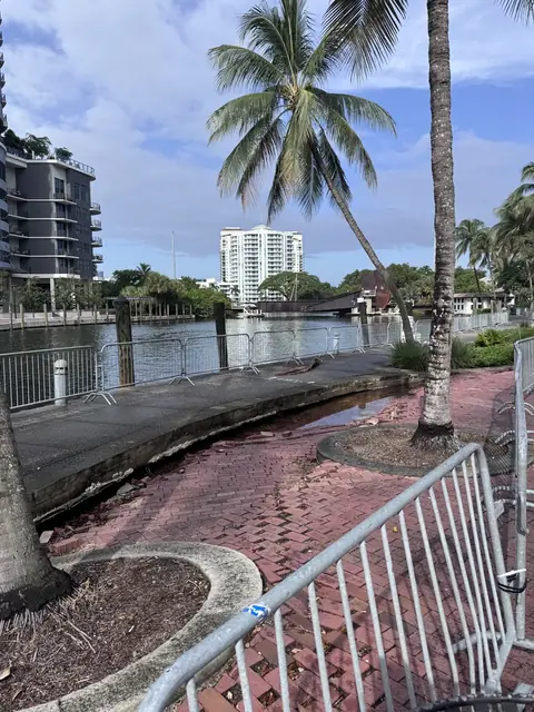 Damaged pavers behind the barricade.